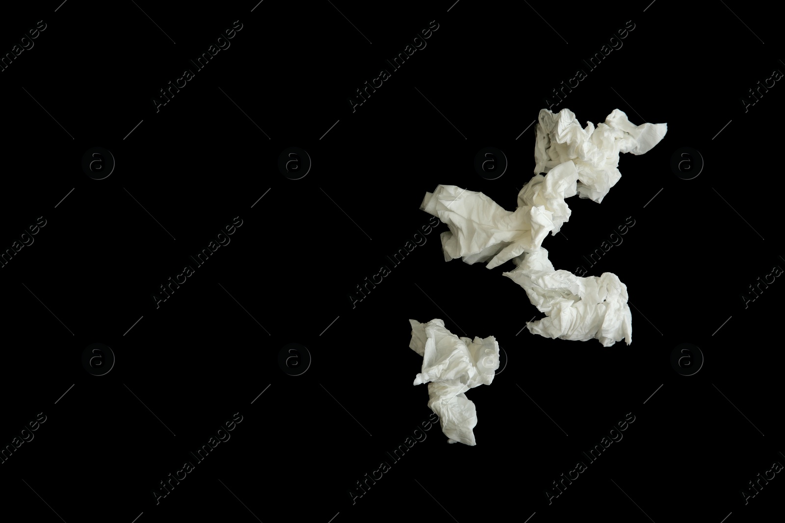 Photo of Used paper tissues on black background, flat lay. Space for text