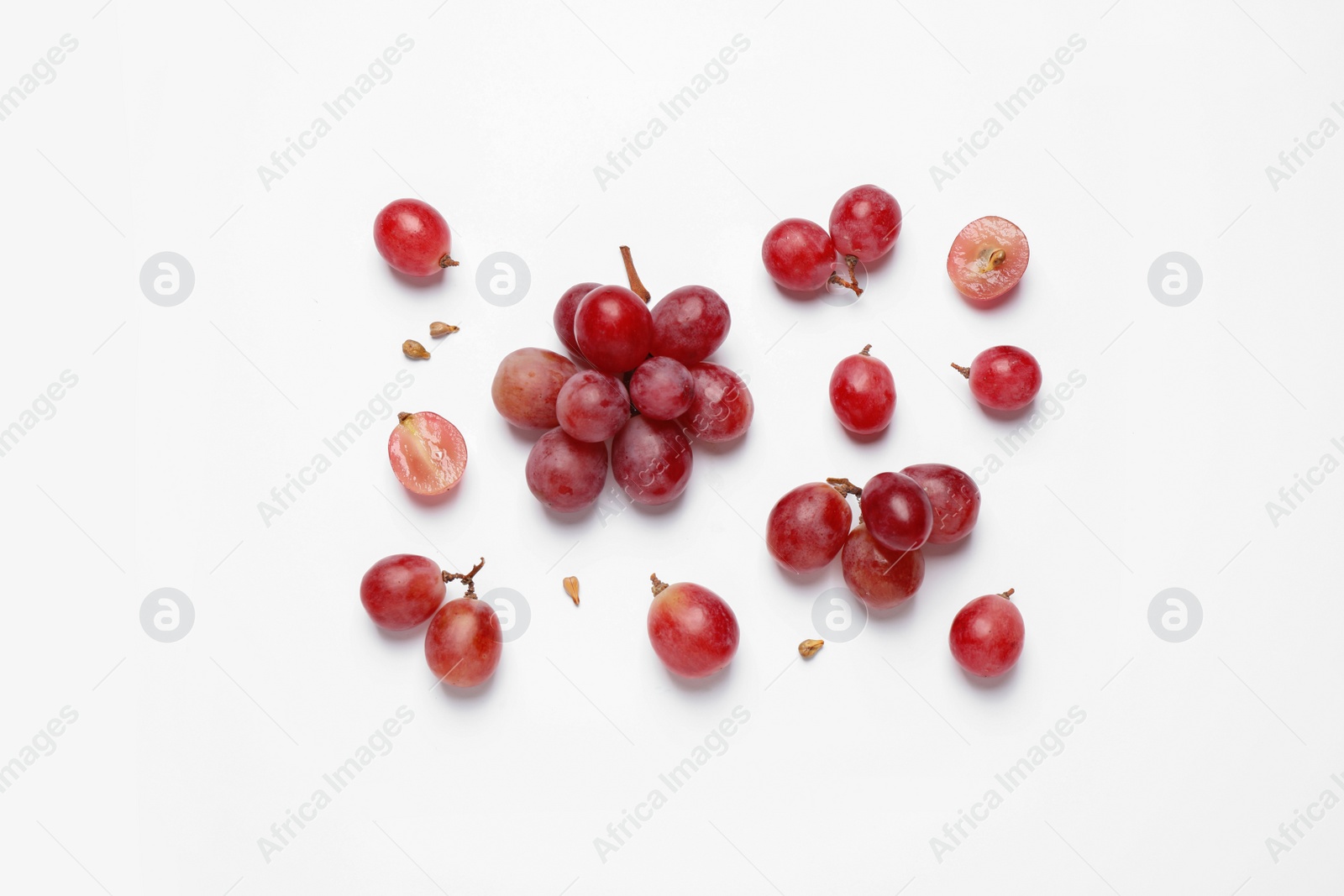 Photo of Composition with fresh ripe grapes and seeds on white background, top view