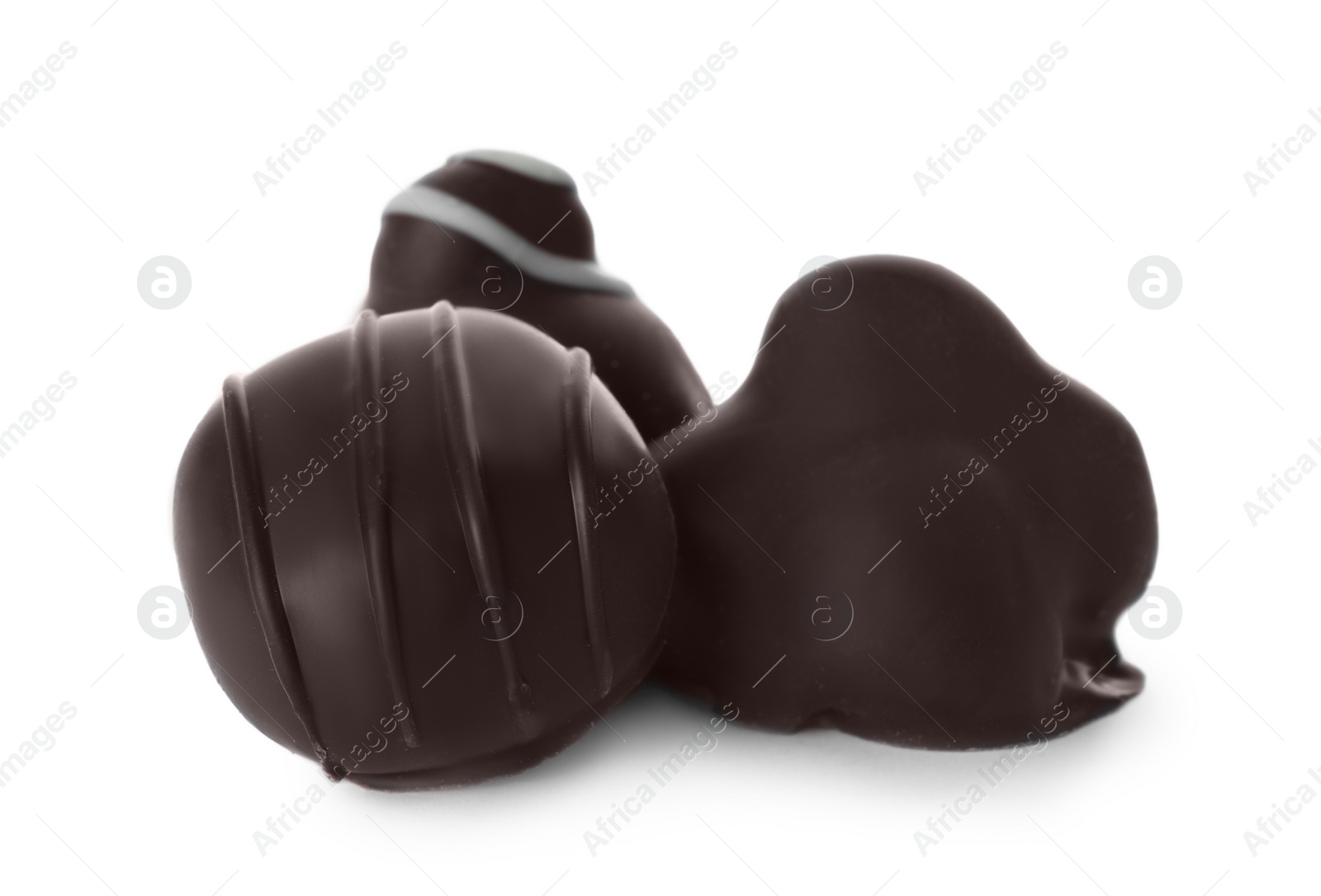 Photo of Variety of tasty chocolate candies isolated on white