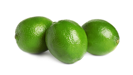 Photo of Fresh green ripe limes isolated on white