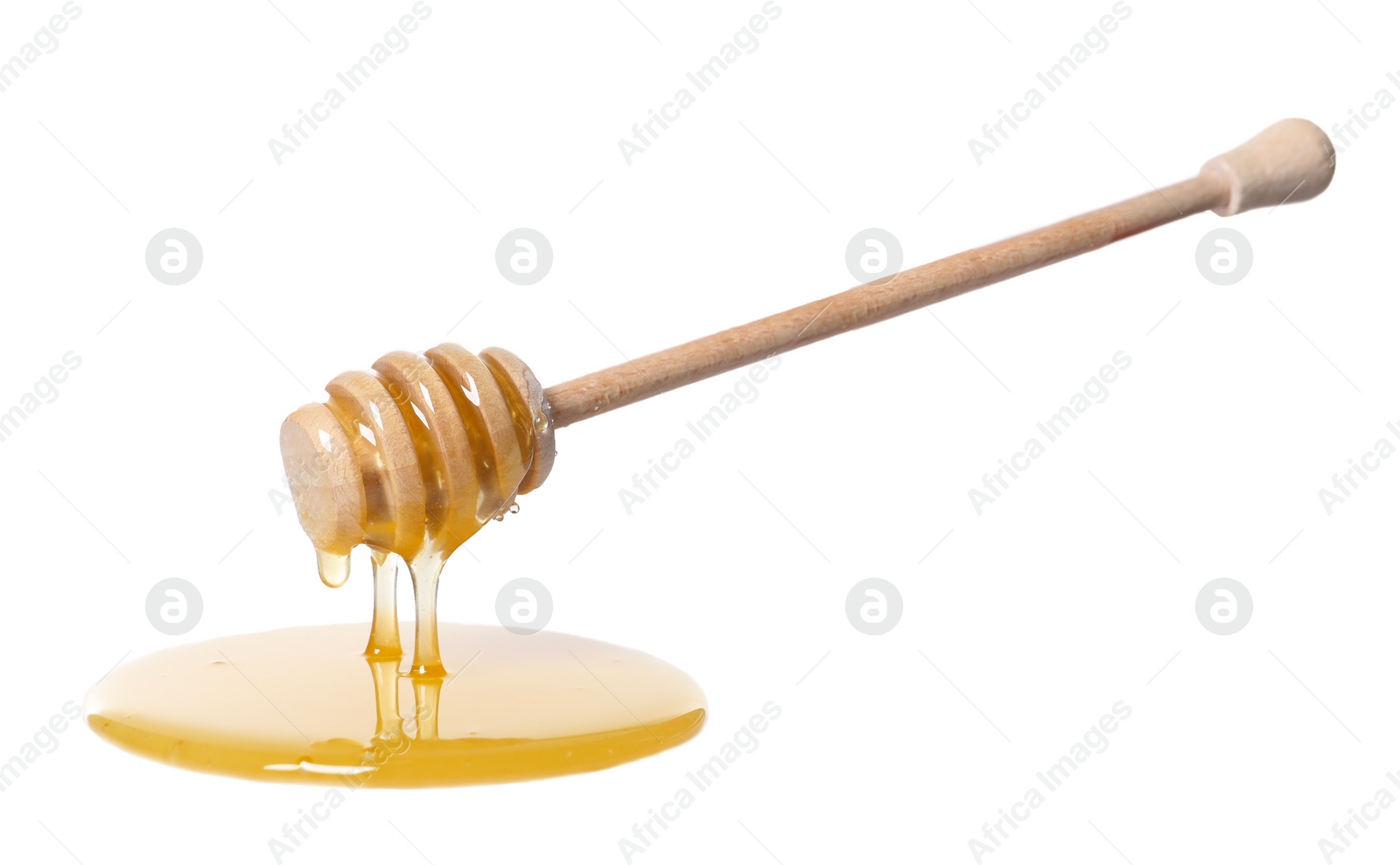 Photo of Natural honey dripping from dipper on white background