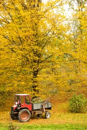 Photo of View of tractor in forest on autumn day
