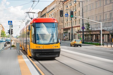 Photo of Streetcar on road in city. Public transport