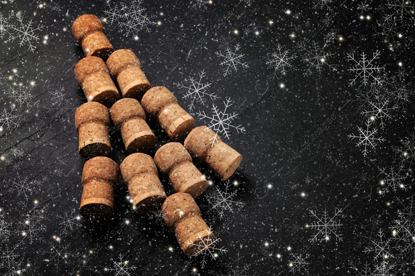 Image of Christmas tree made of sparkling wine corks on black background