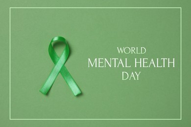 Image of World Mental Health Day. Green ribbon on color background, top view