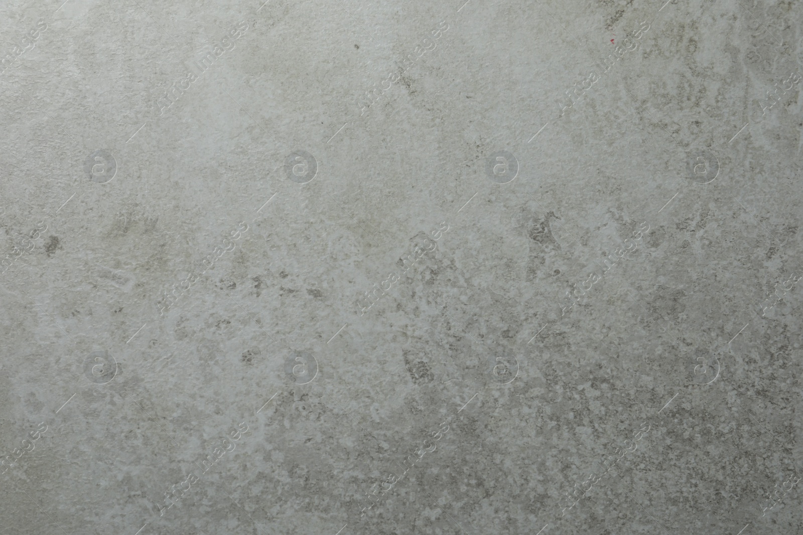 Photo of Texture of light grey stone surface as background, closeup