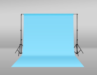 Image of Modern light blue photo background. Professional studio equipment