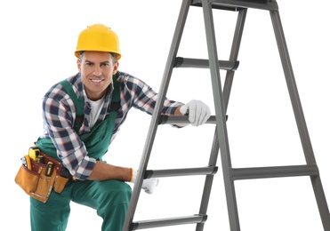Photo of Professional builder near metal ladder on white background
