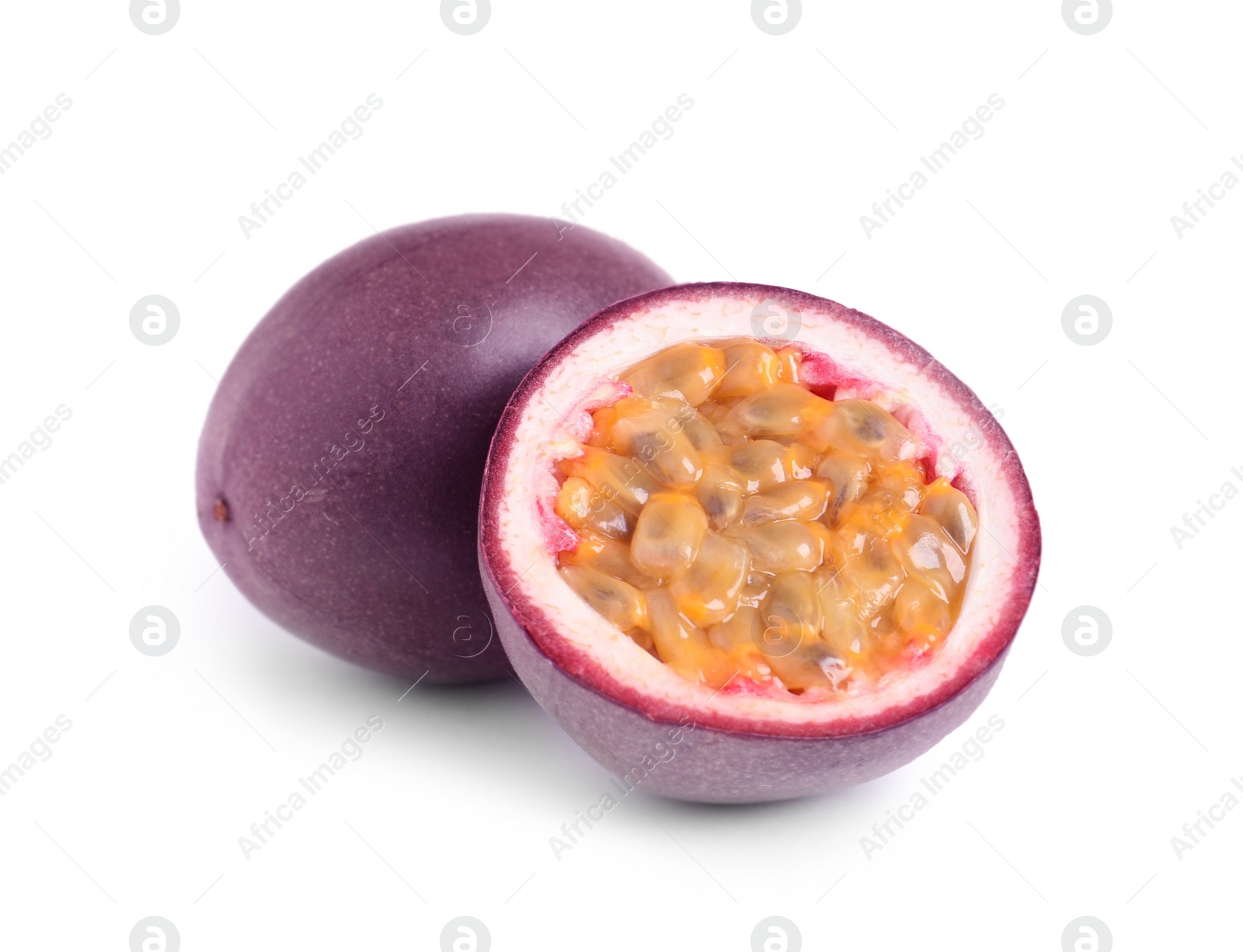 Photo of Cut and whole passion fruits isolated on white