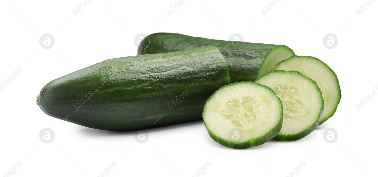 Photo of Halves and slices of long cucumber isolated on white