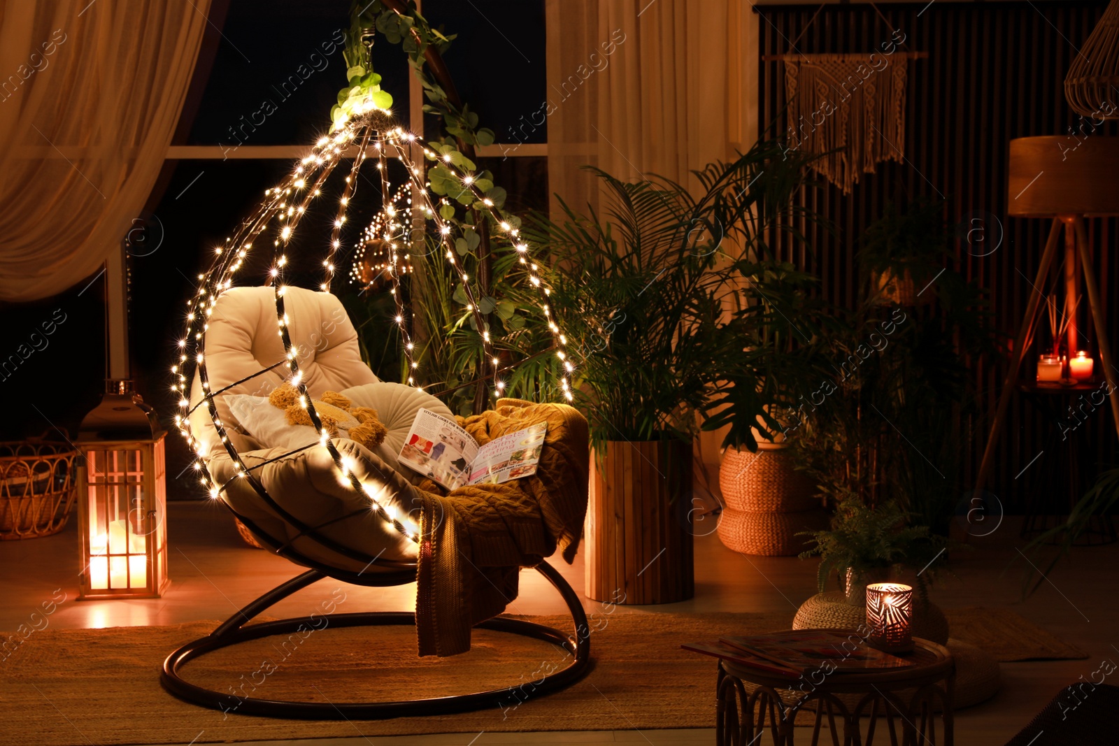 Photo of Indoor terrace interior with comfortable hanging chair and houseplants