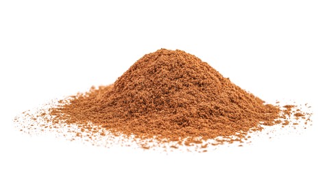 Dry aromatic cinnamon powder isolated on white