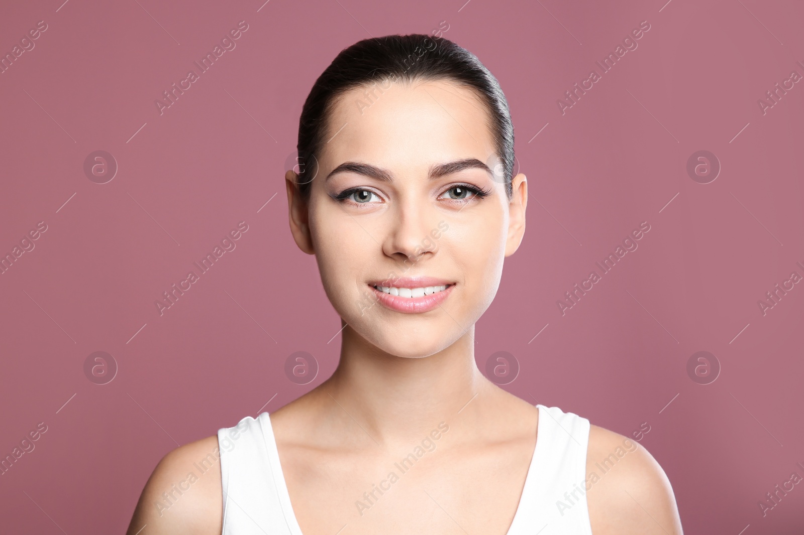 Photo of Young woman with sexy lips on color background