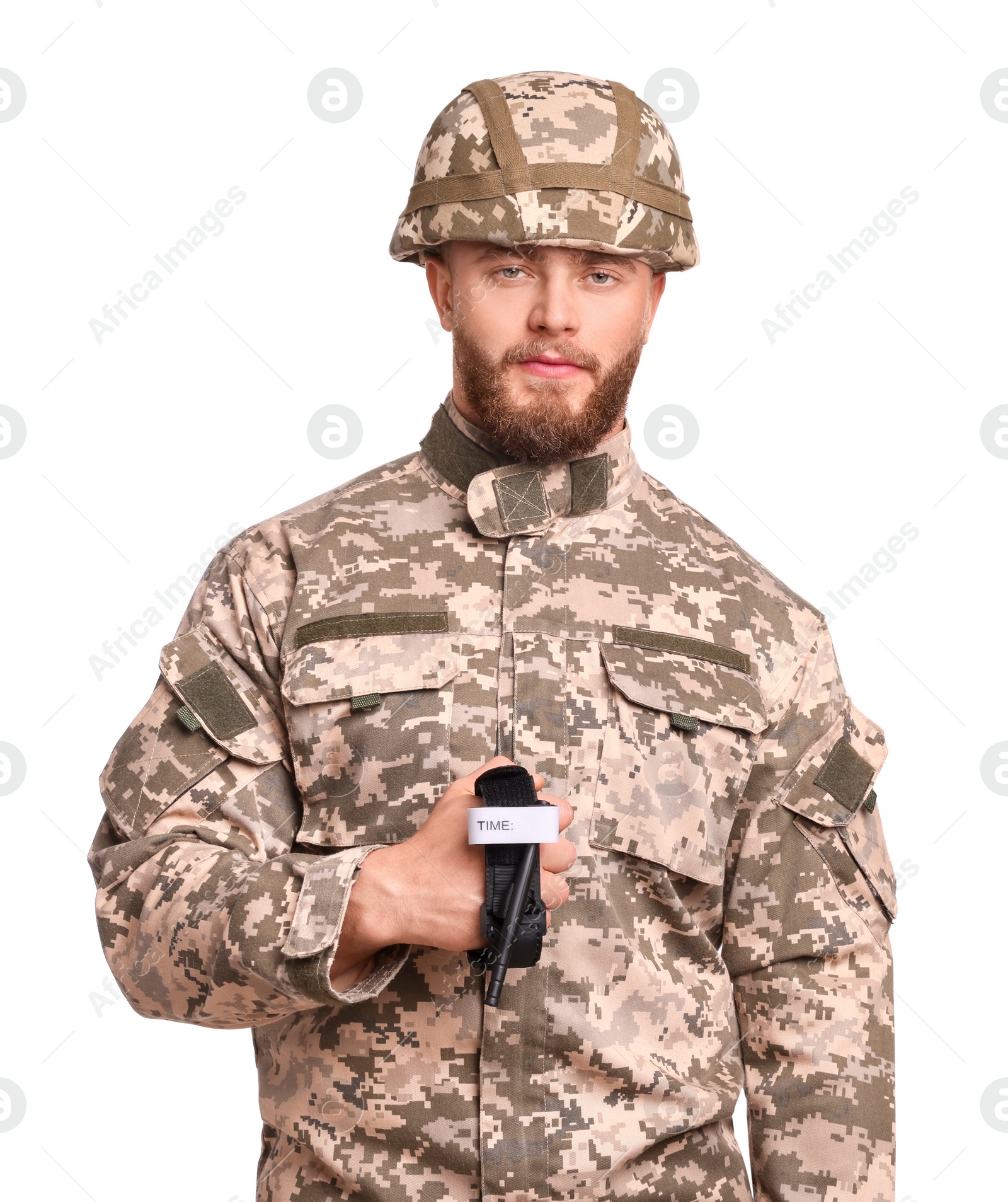 Photo of Soldier in military uniform holding medical tourniquet on white background