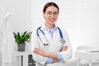 Medical consultant with glasses and stethoscope in clinic