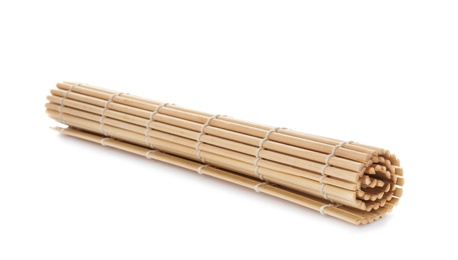 Photo of Rolled sushi mat made of bamboo on white background