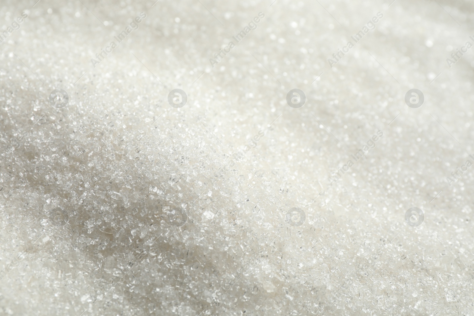 Photo of Pile of granulated sugar as background, closeup