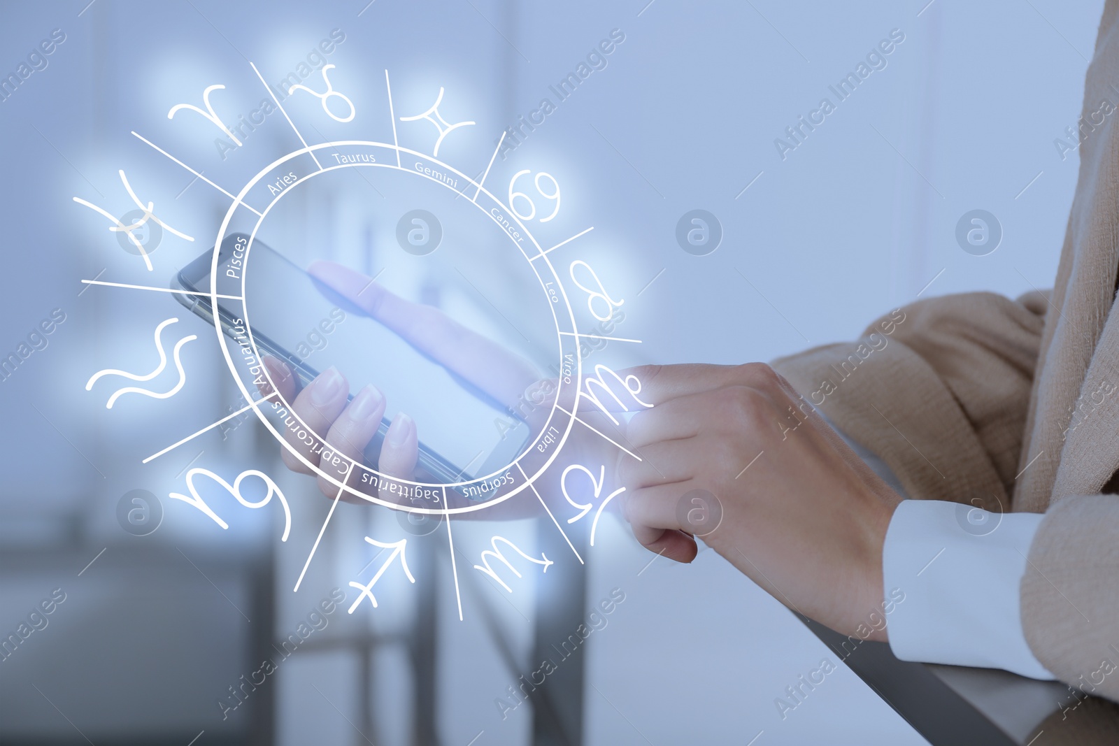 Image of Woman with smartphone reading daily horoscope indoors, closeup