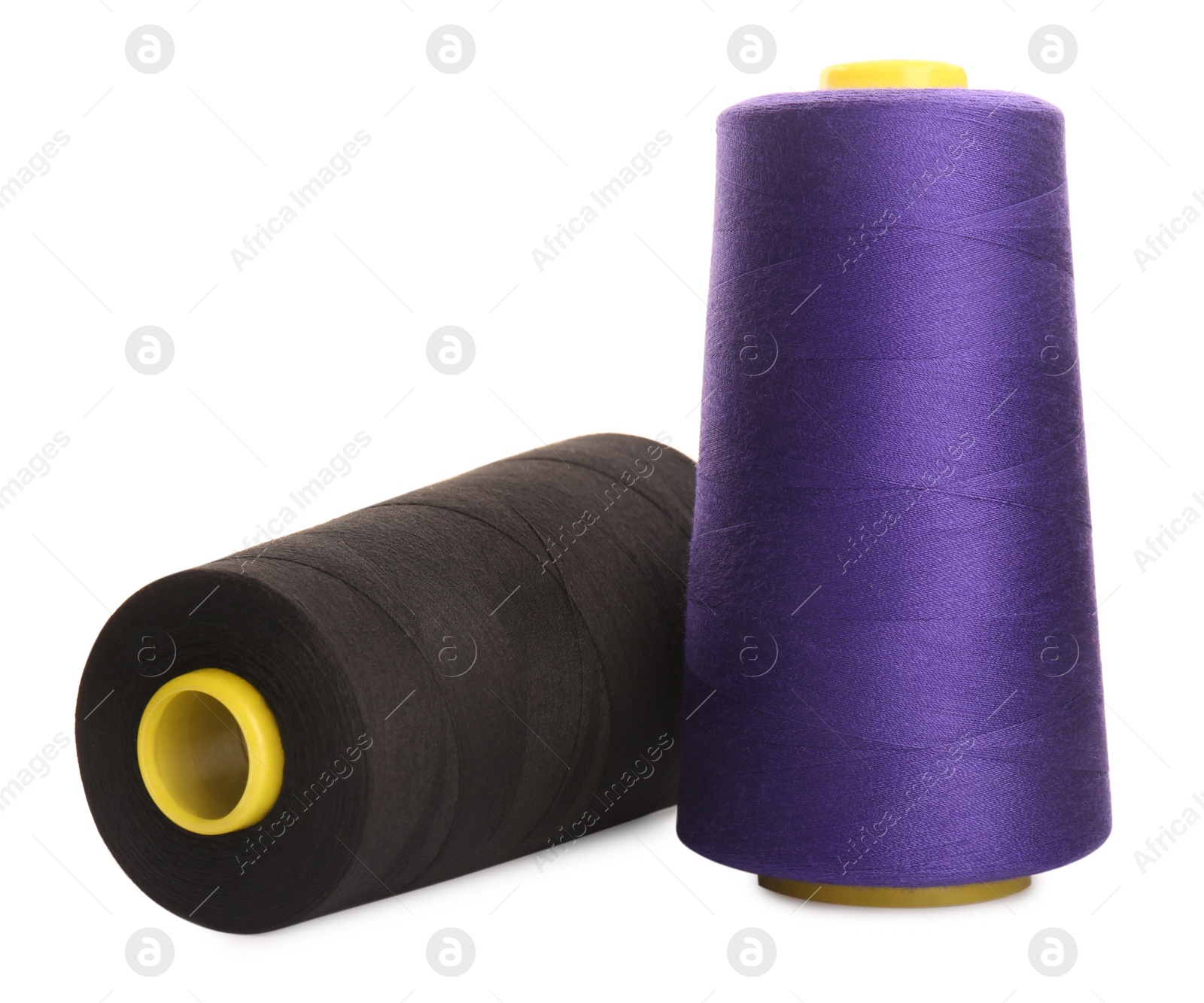 Photo of Different colorful sewing threads on white background