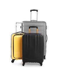 Modern suitcases for travelling on white background