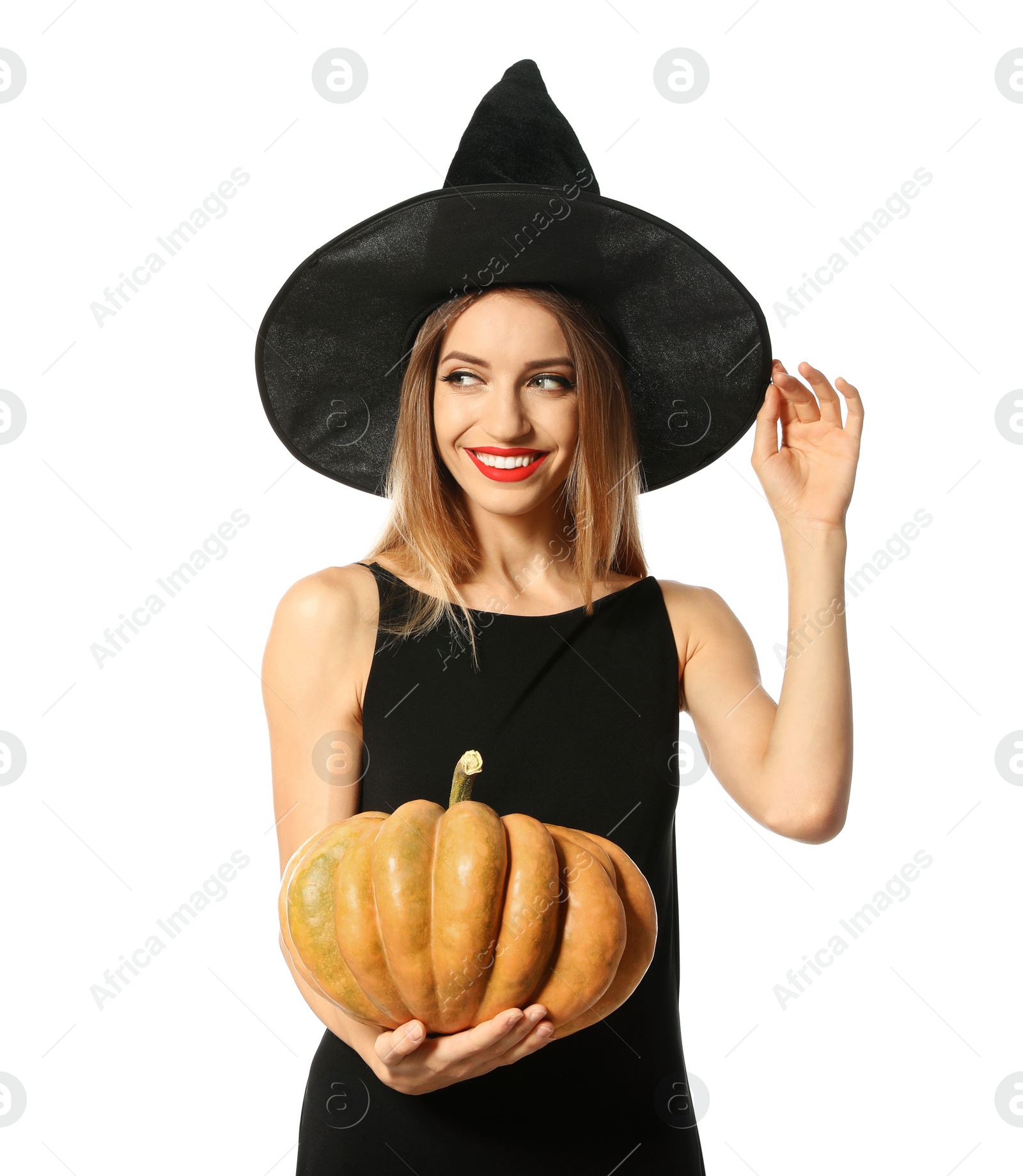 Photo of Beautiful woman wearing witch costume with pumpkin for Halloween party on white background