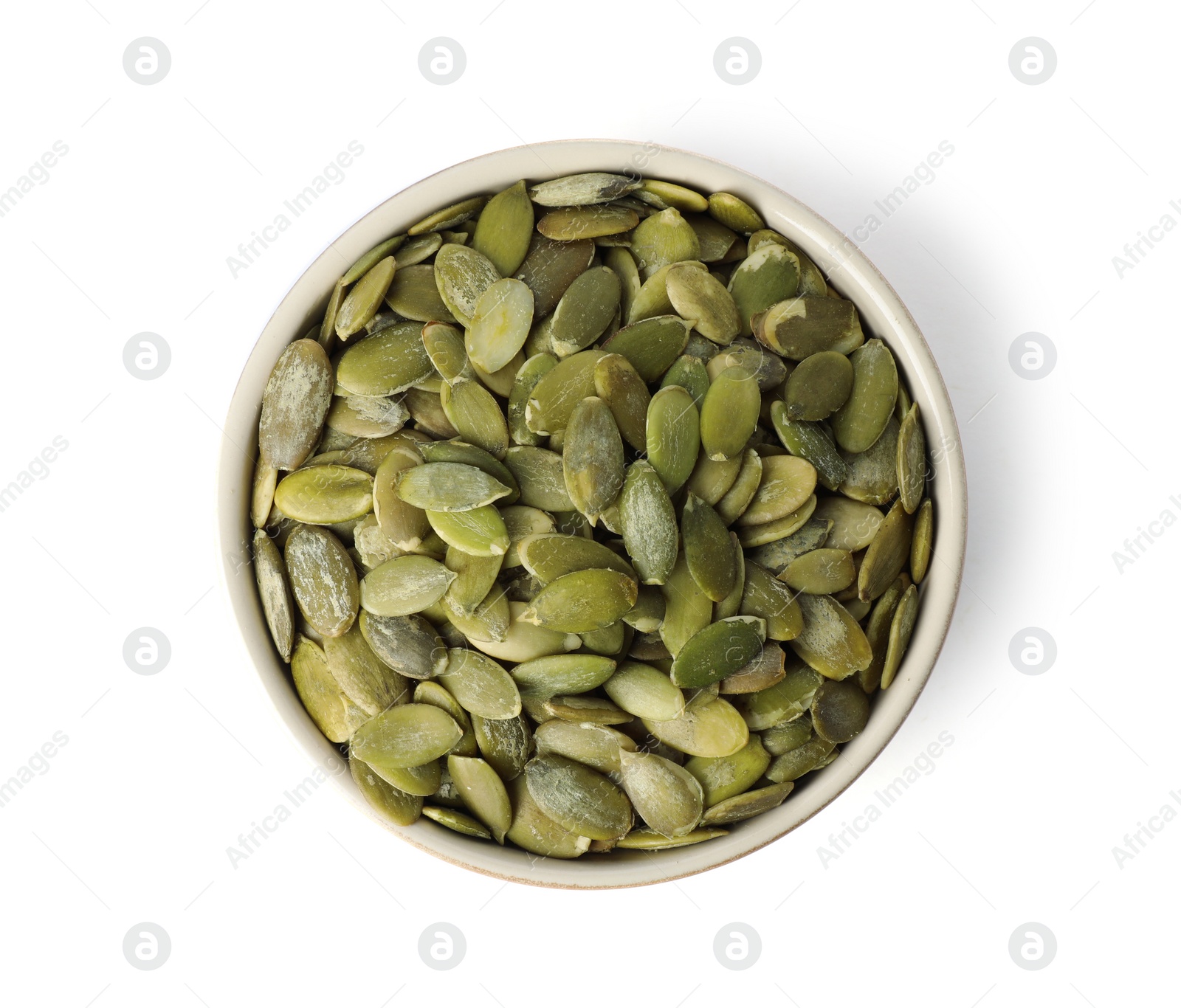 Photo of Shelled raw pumpkin seeds in bowl on white background, top view