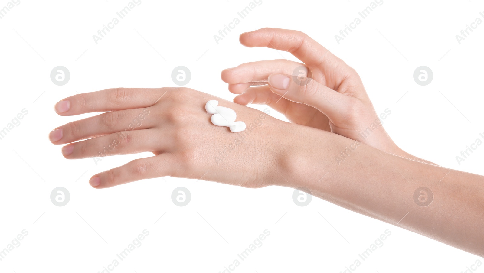 Photo of Young woman applying hand cream against on white background