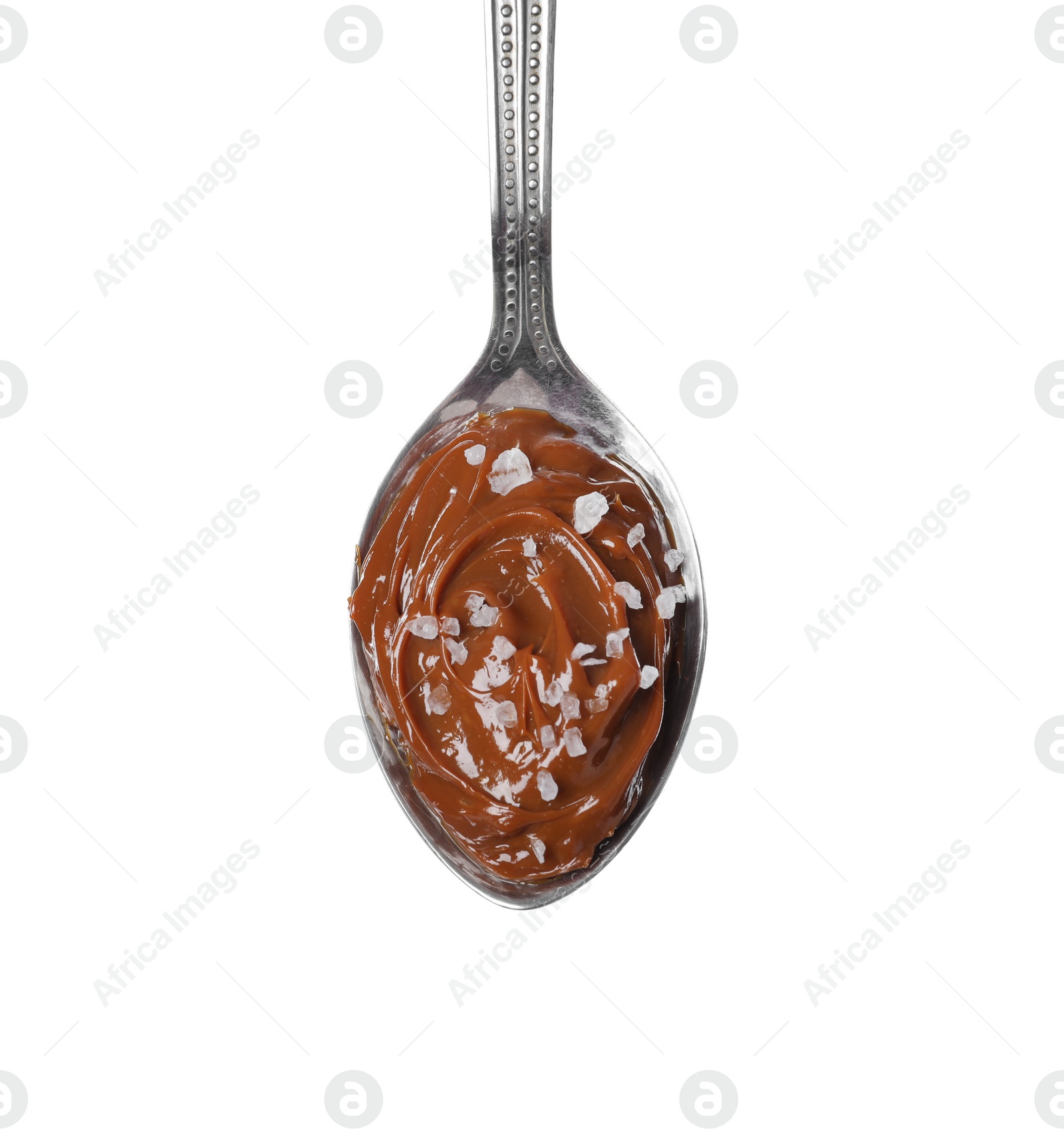 Photo of Salted caramel in spoon isolated on white