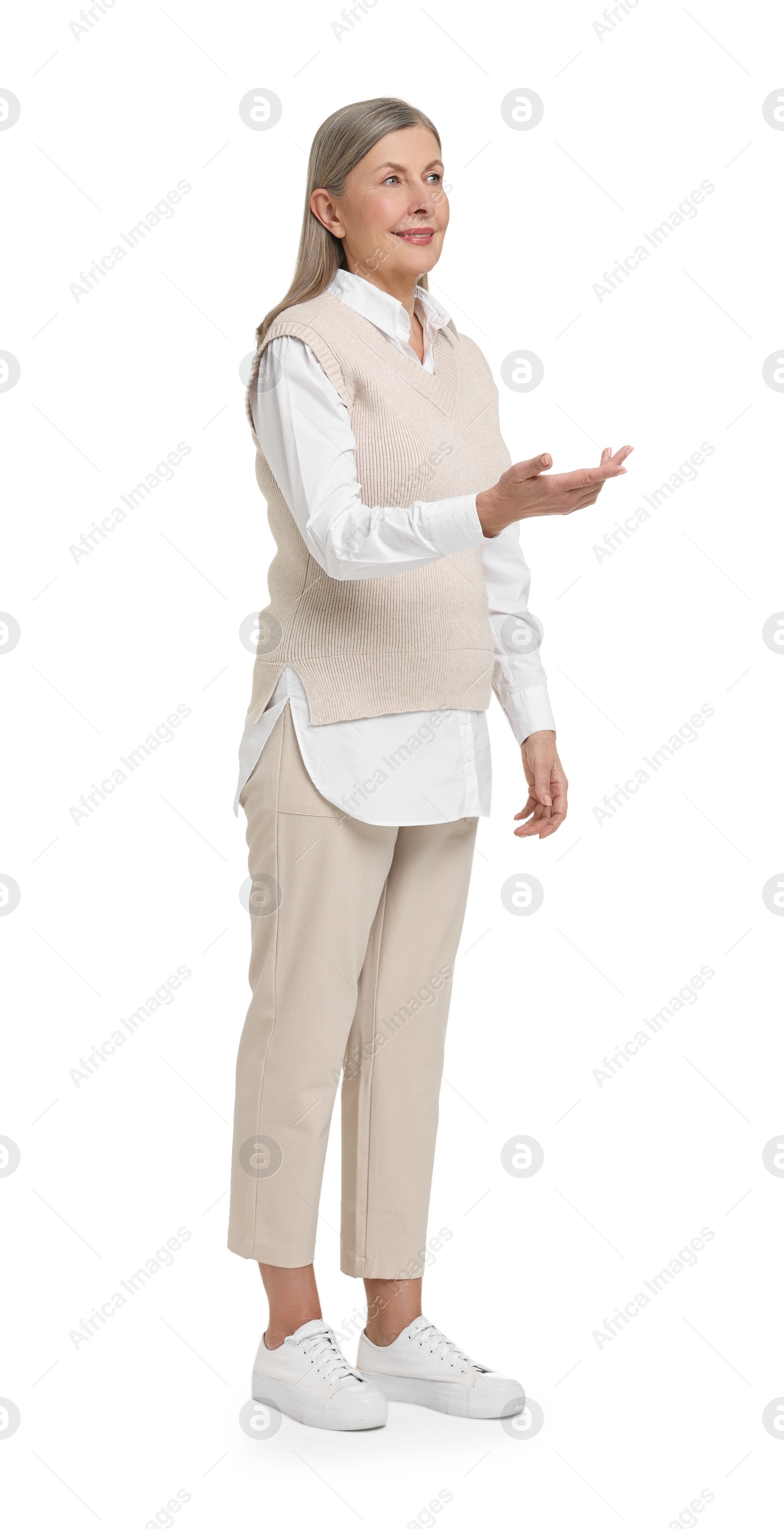 Photo of Full length portrait of senior woman on white background