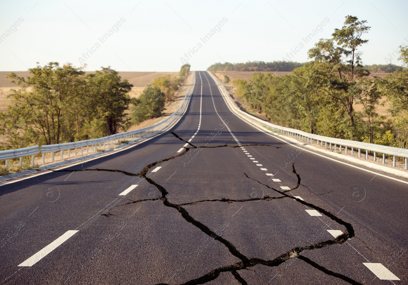 Image of Large cracks on asphalt road after earthquake