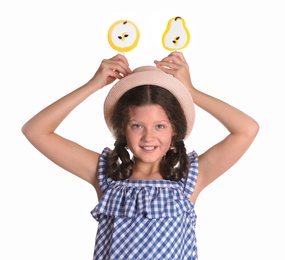 Photo of Little girl with candies on white background