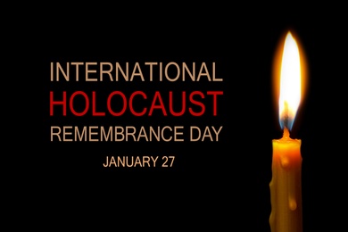 Image of International Holocaust Remembrance Day January 27. Burning candle on black background