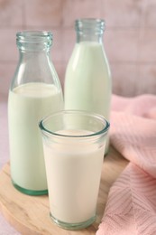 Photo of Glassware with tasty milk on table, closeup