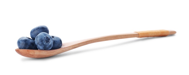 Photo of Wooden spoon full of fresh ripe blueberries on white background