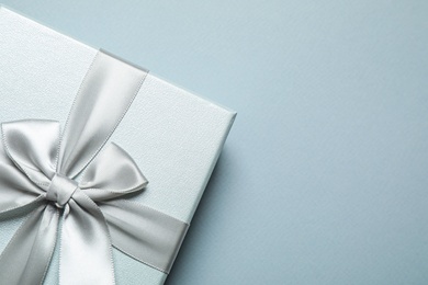 Photo of Beautiful gift box on grey background, top view. Space for text