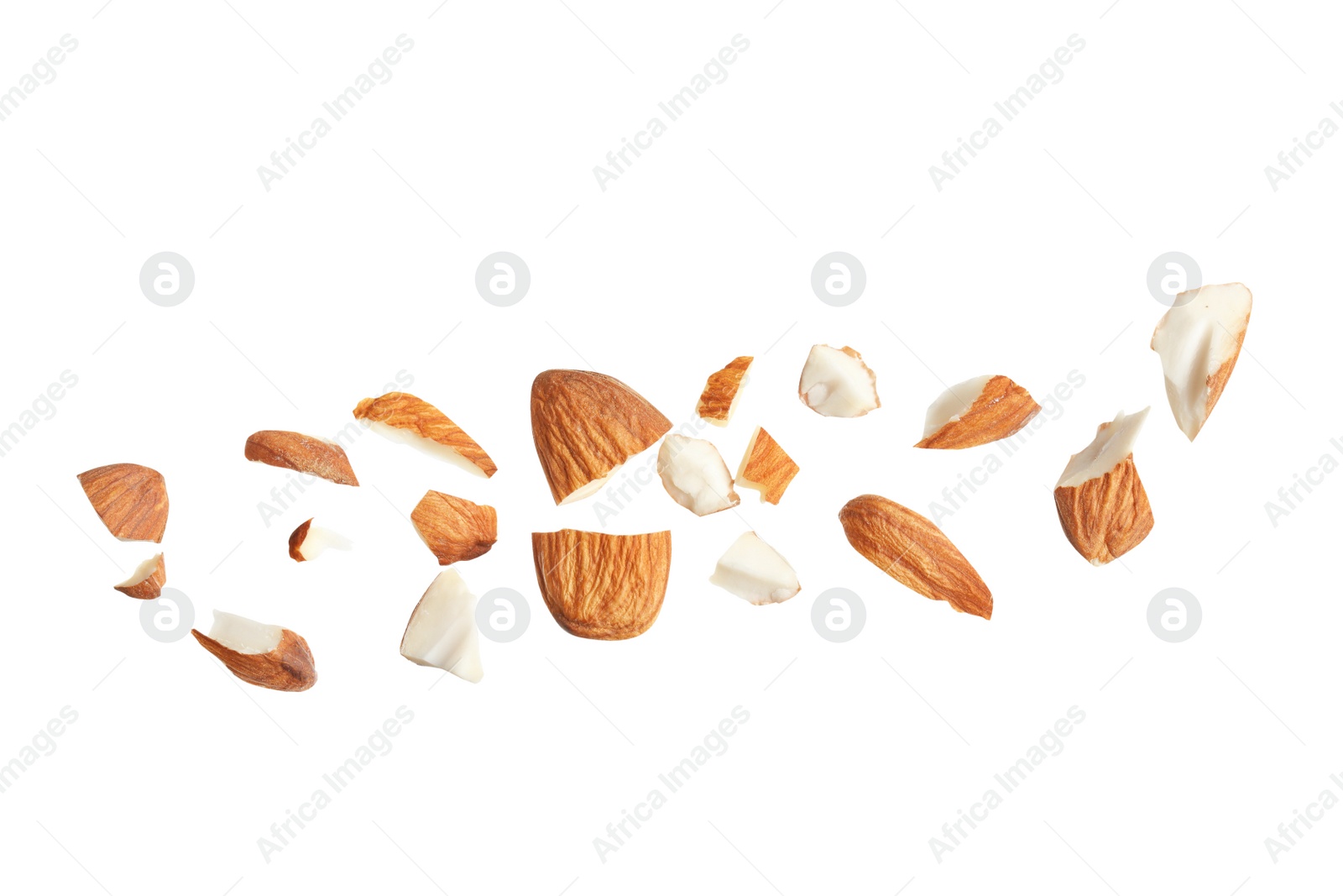 Photo of Pieces of tasty almonds on white background