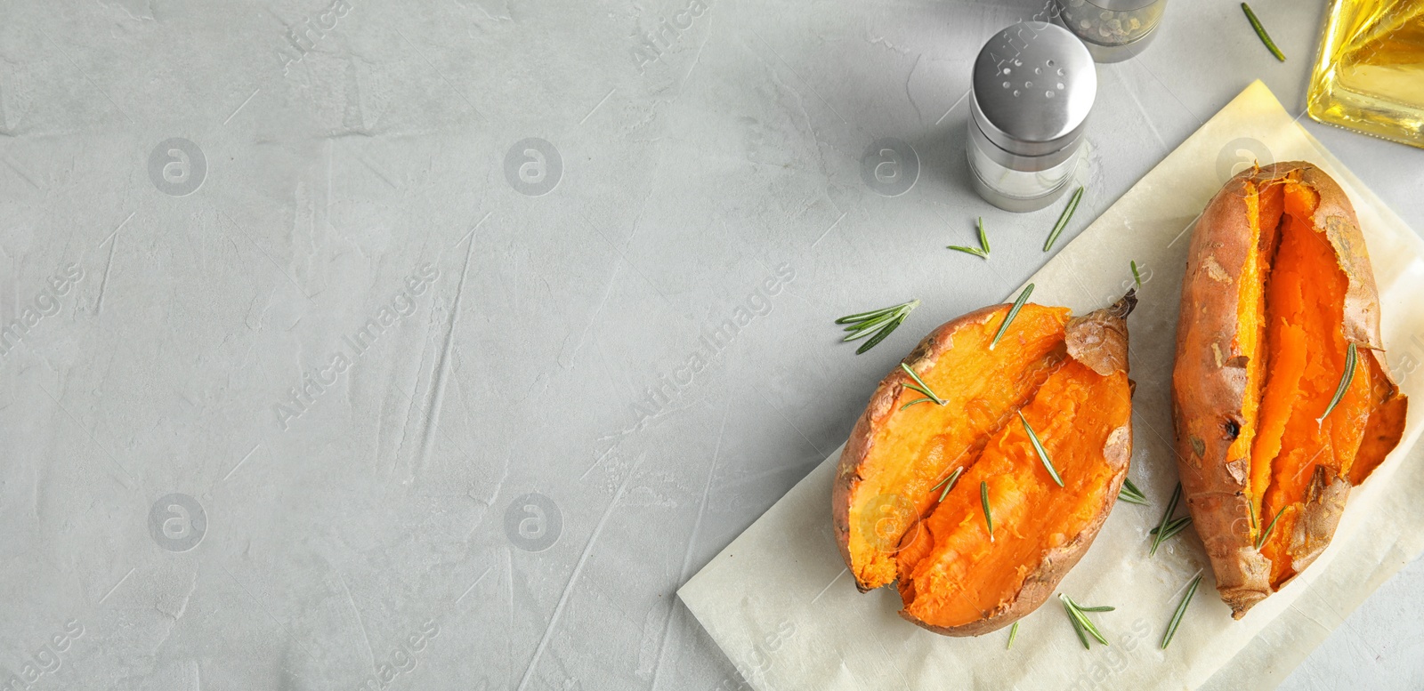 Image of Flat lay composition with baked sweet potatoes on light grey background, space for text. Banner design