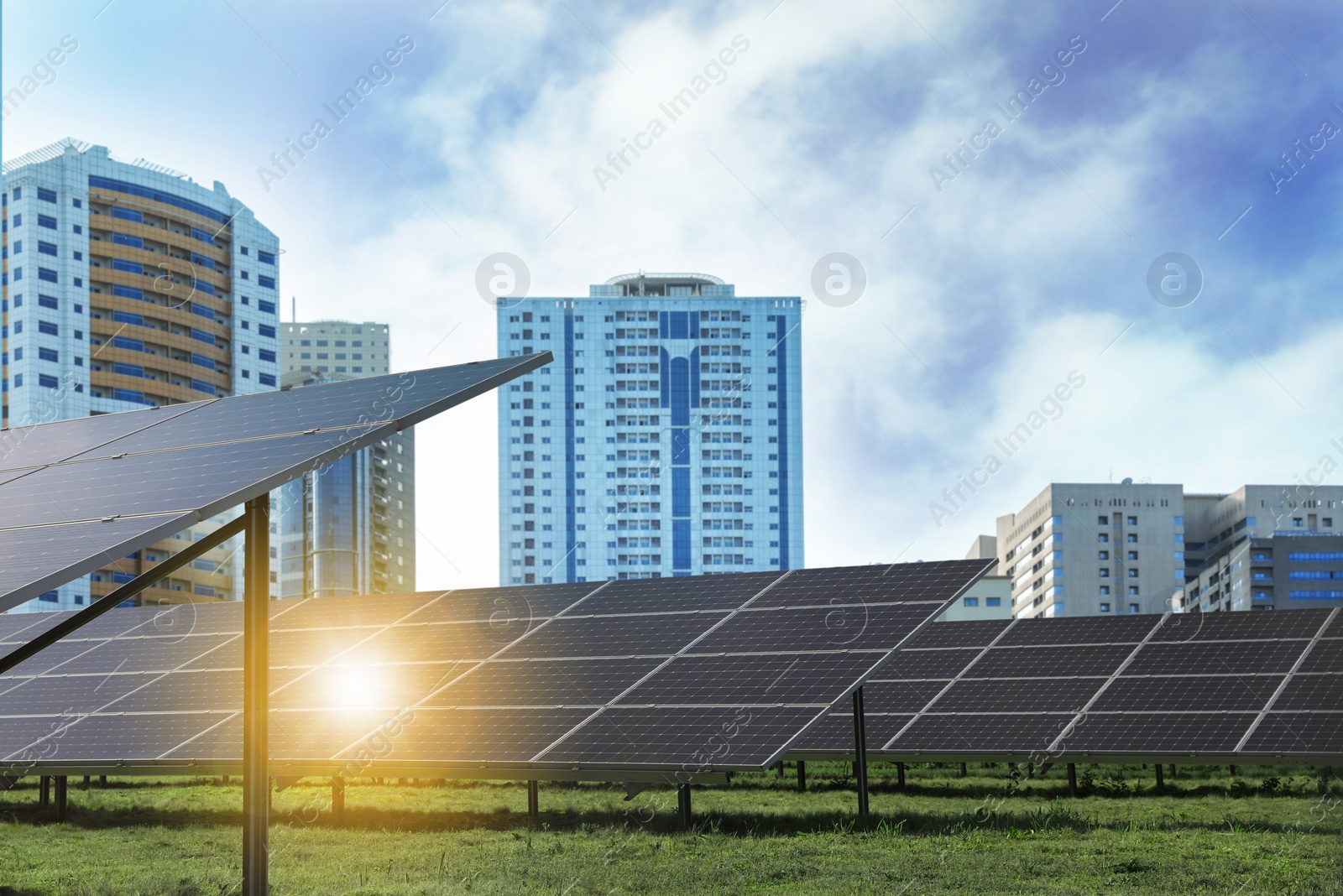 Image of Cityscape and solar panels installed outdoors. Alternative energy source