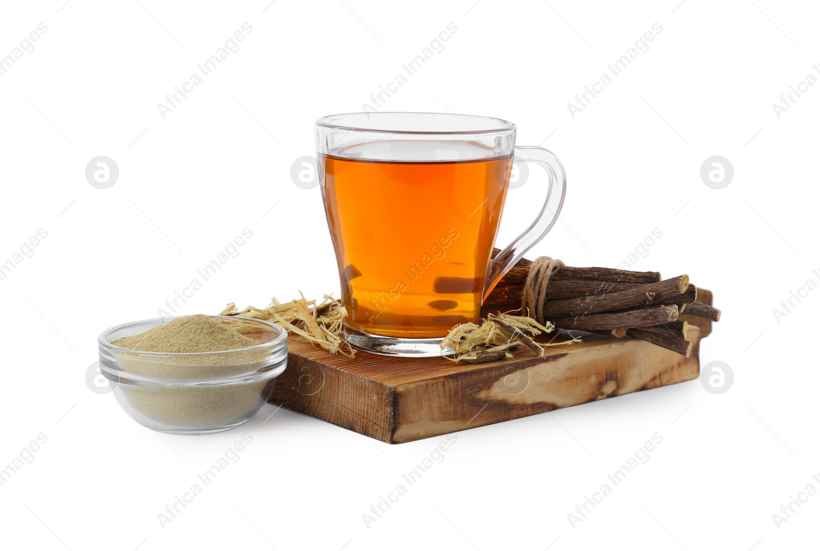 Photo of Aromatic licorice tea in cup, dried sticks of licorice root and powder isolated on white