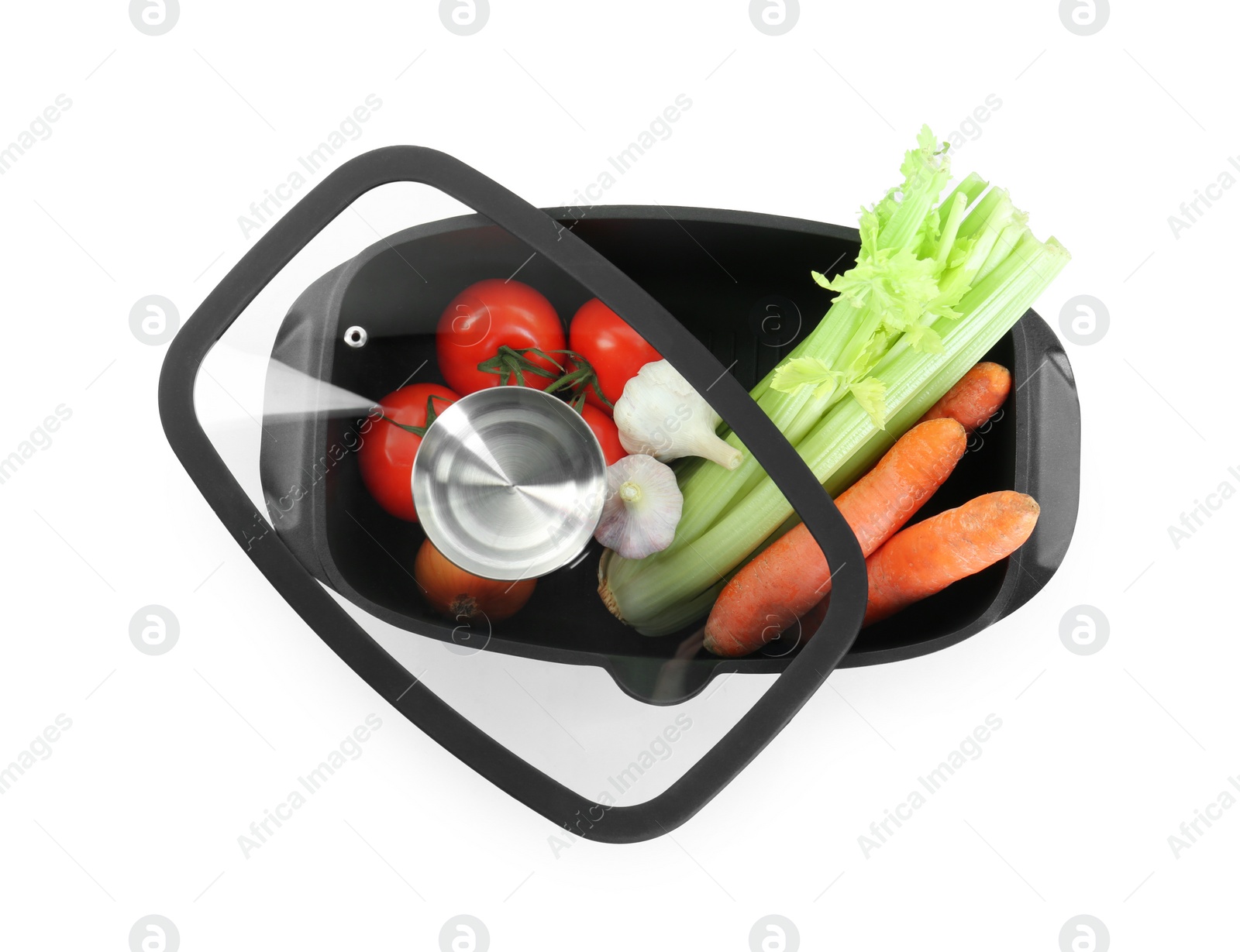 Photo of Fresh products in black pot and lid isolated on white, top view