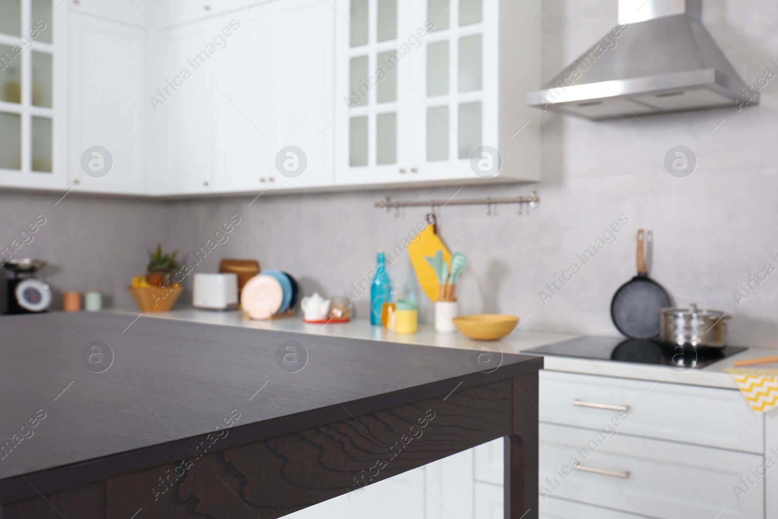 Photo of Stylish wooden table in kitchen. Interior design