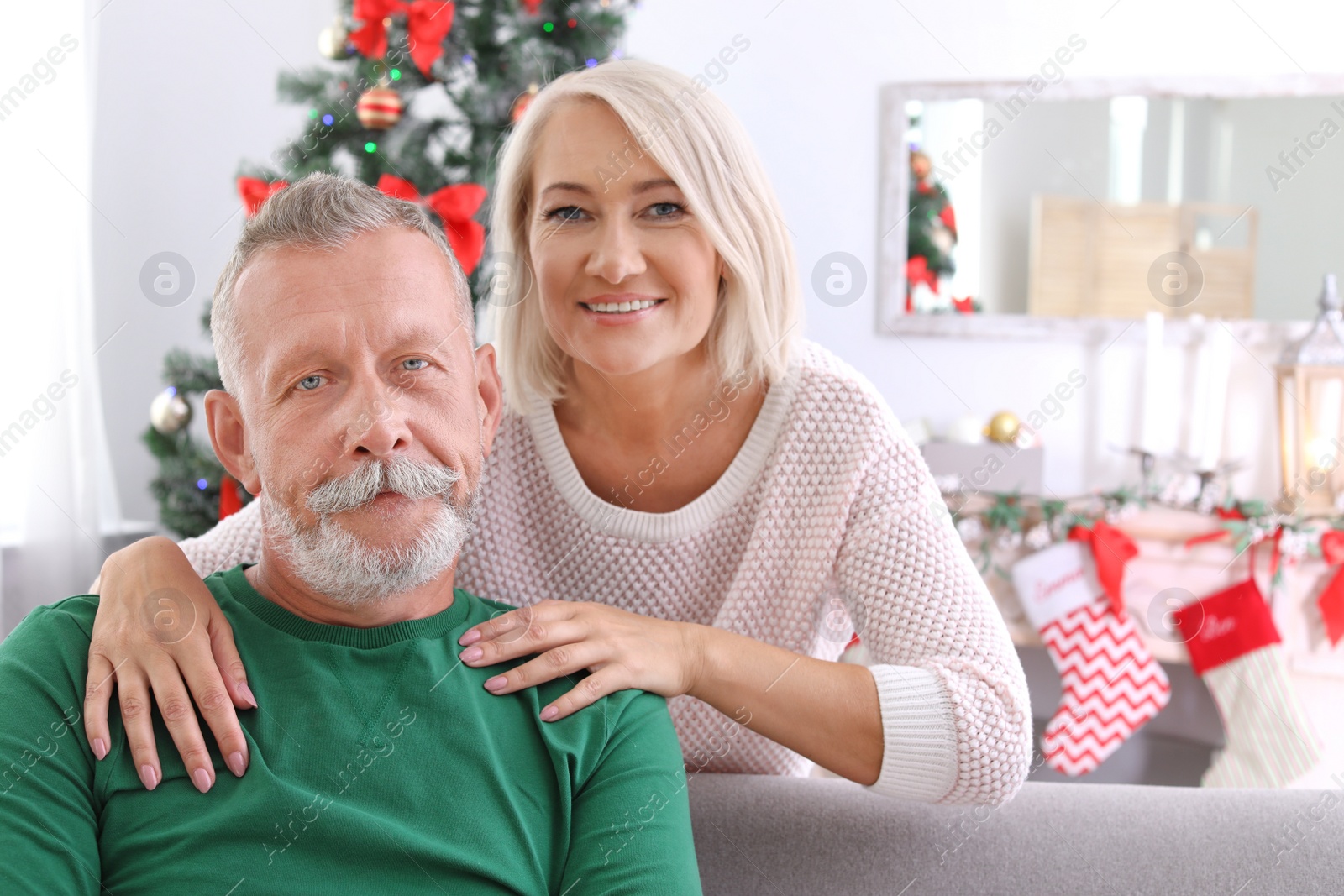 Photo of Mature couple together at home. Christmas celebration