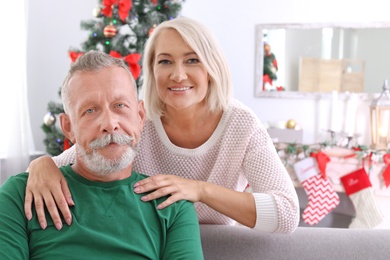 Mature couple together at home. Christmas celebration