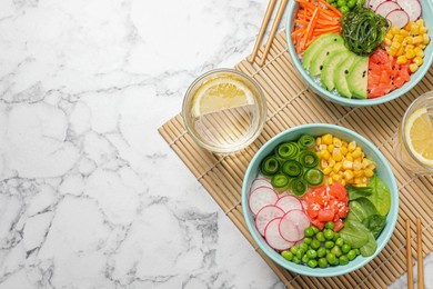 Photo of Delicious salad with salmon and vegetables served on white marble table, flat lay. Space for text