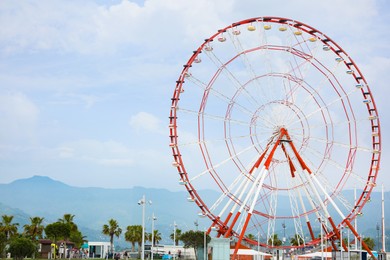 Photo of Beautiful large Ferris wheel outdoors, space for text