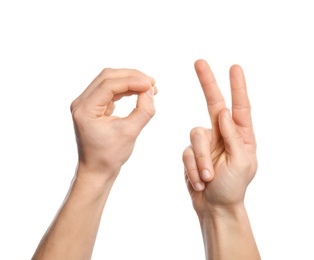 Photo of Man showing word okay on white background, closeup. Sign language