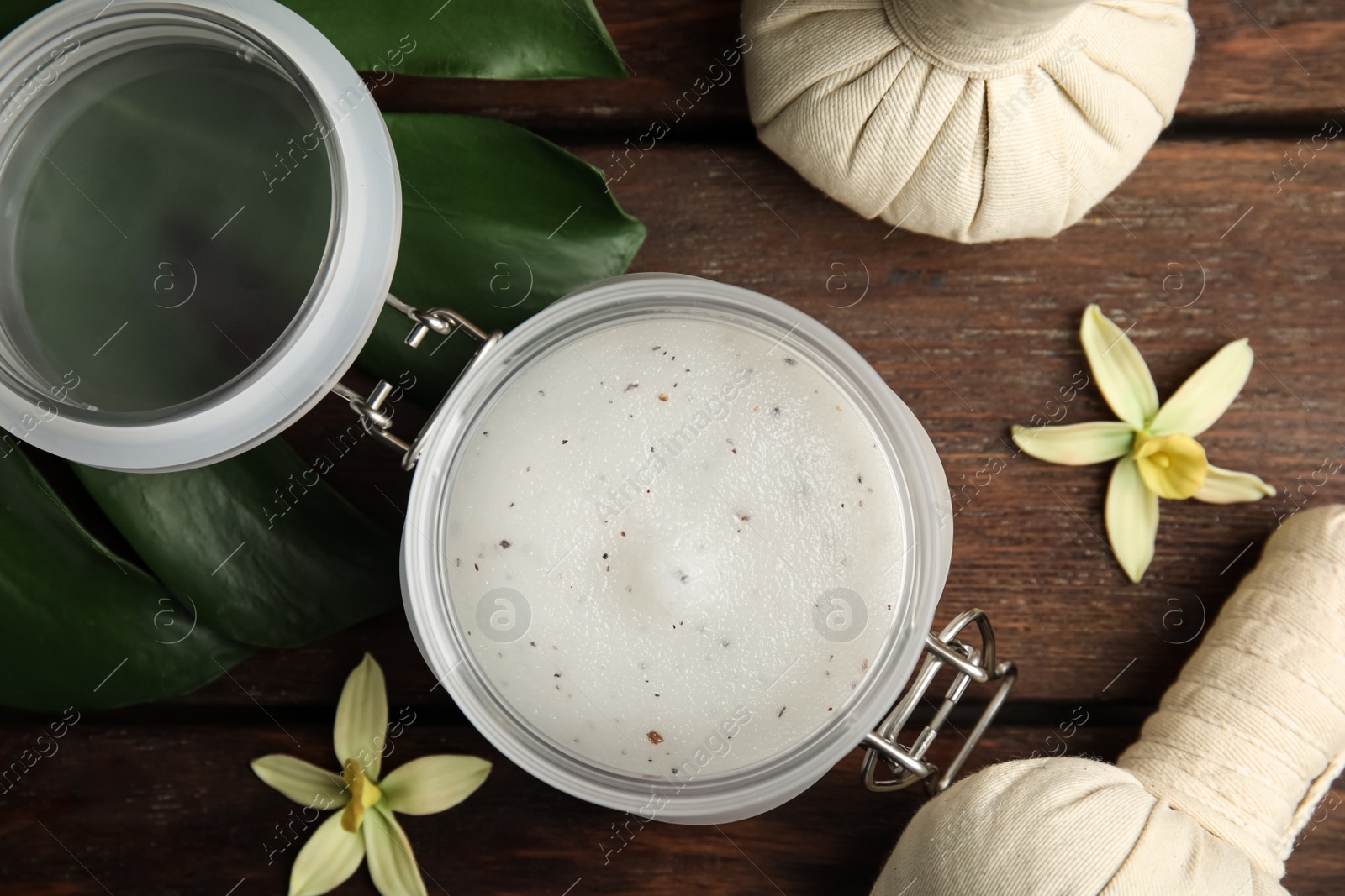 Photo of Flat lay composition with salt scrub on wooden table