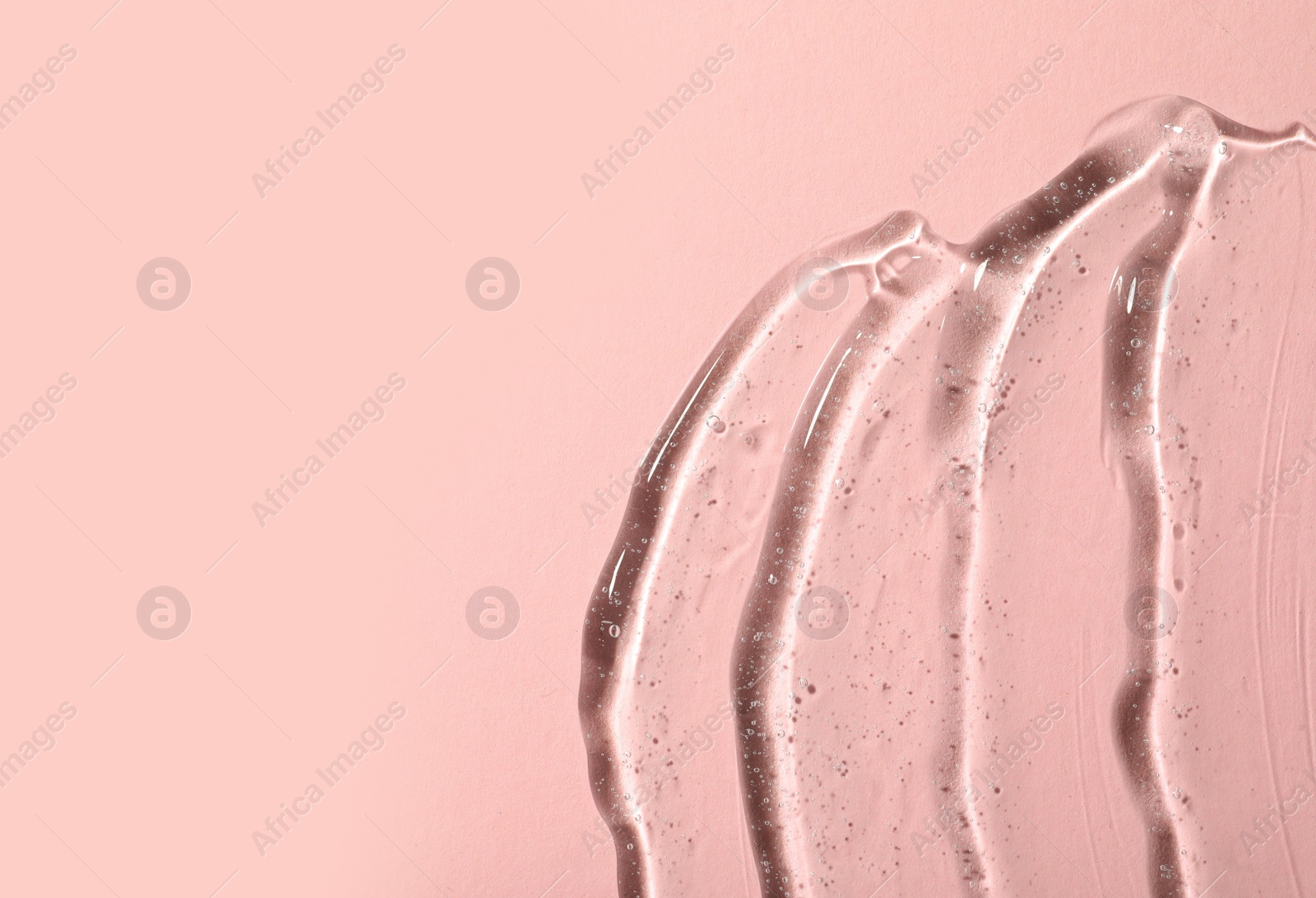 Photo of Cosmetic gel on pink background, top view. Space for text