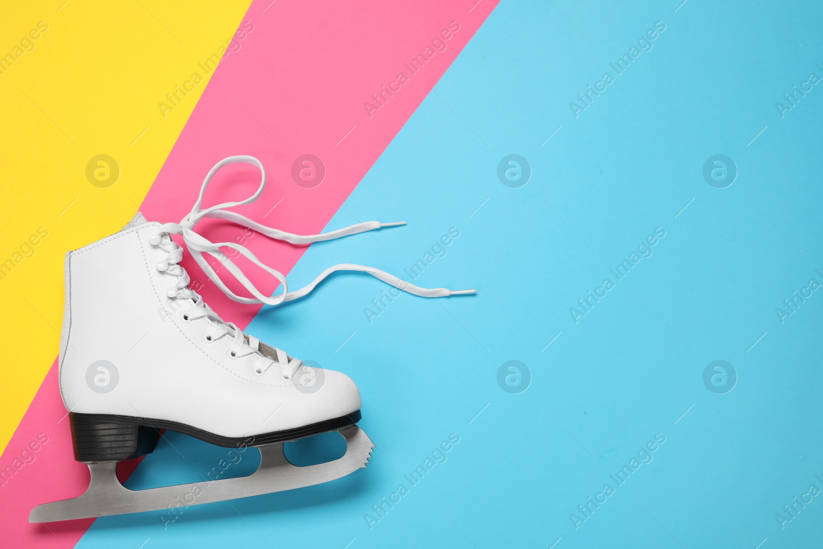 Photo of Skate on color background, top view. Space for text