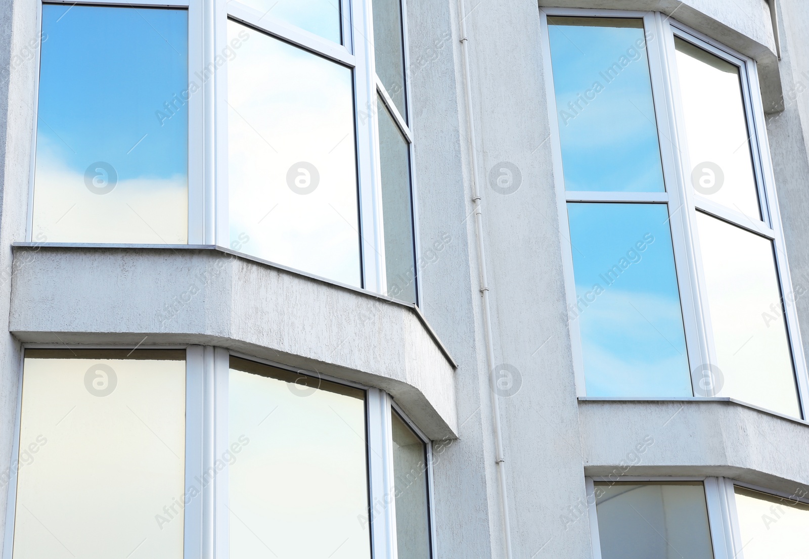 Photo of Modern office building with tinted windows. Urban architecture